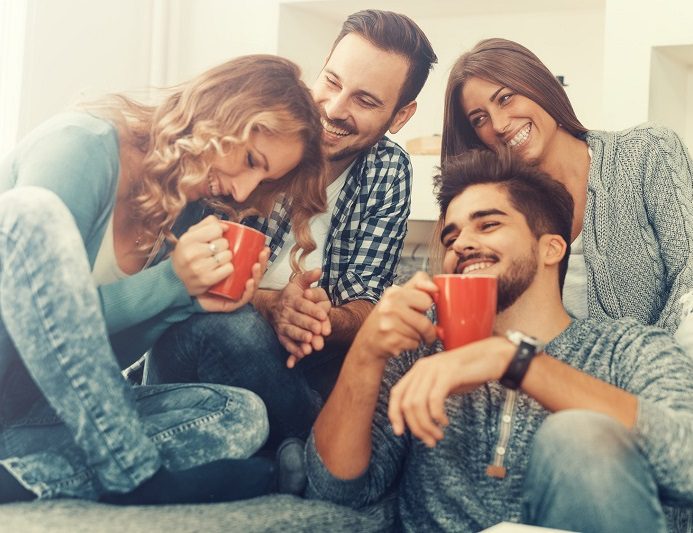 Cheerful Group Of Friends Having Fun At Home