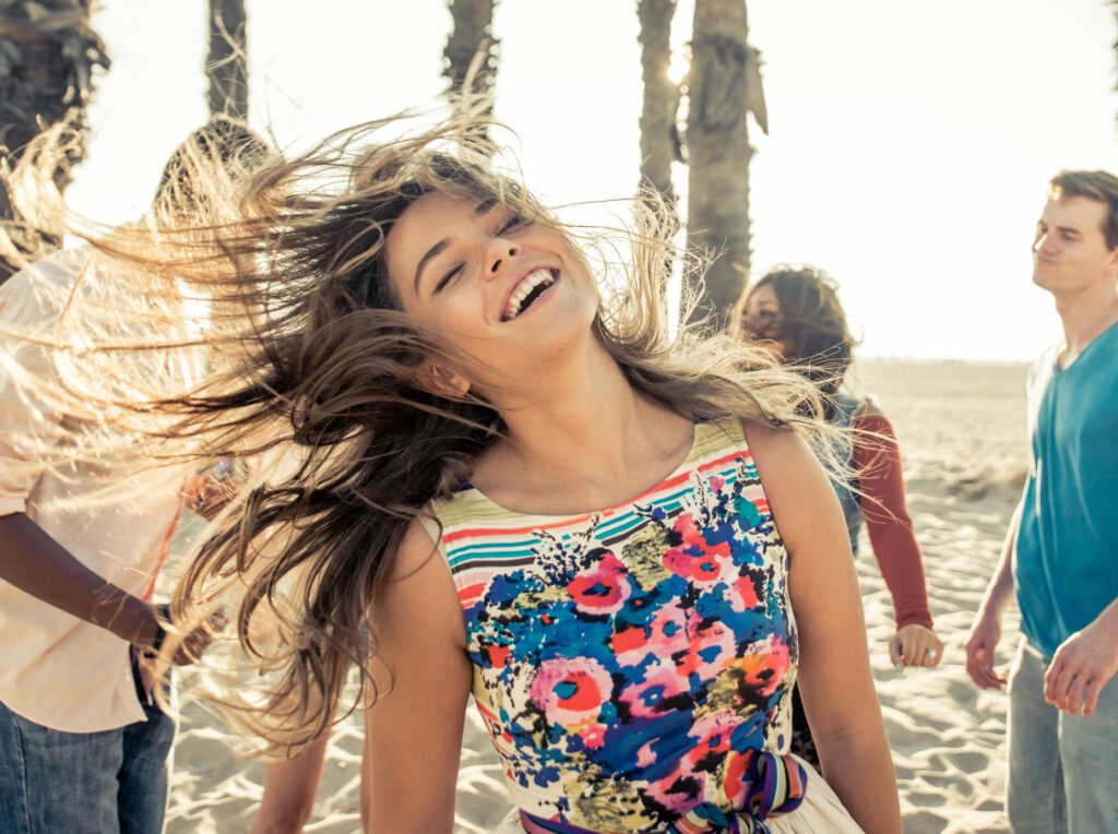 Group Of Friends Celebrating On The Beach In LA