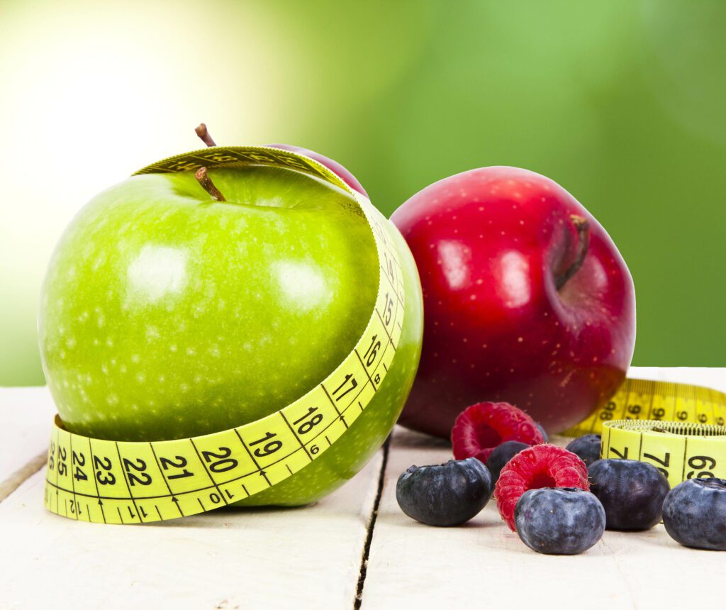 fresh fruit with measuring cintra concept of healthy diet