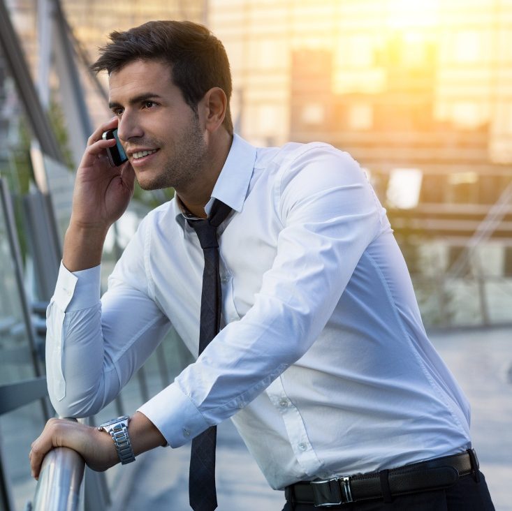 Businessman talking on phone in financial district
