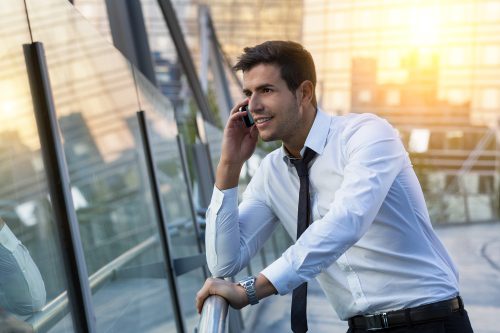Businessman talking on phone in financial district