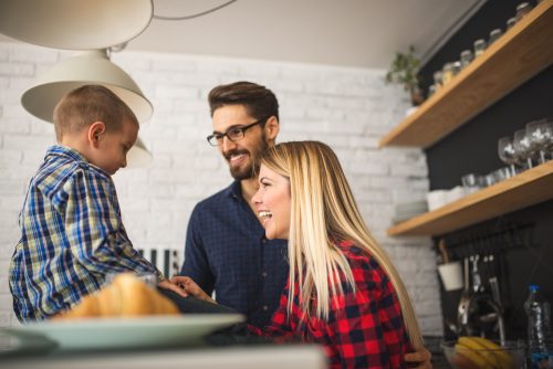 Shot of a happy family preparing for breakfast.