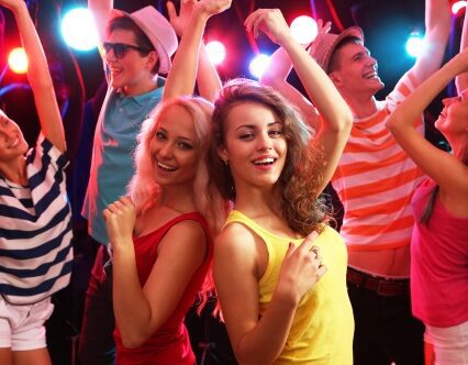 Young people having fun dancing at party.